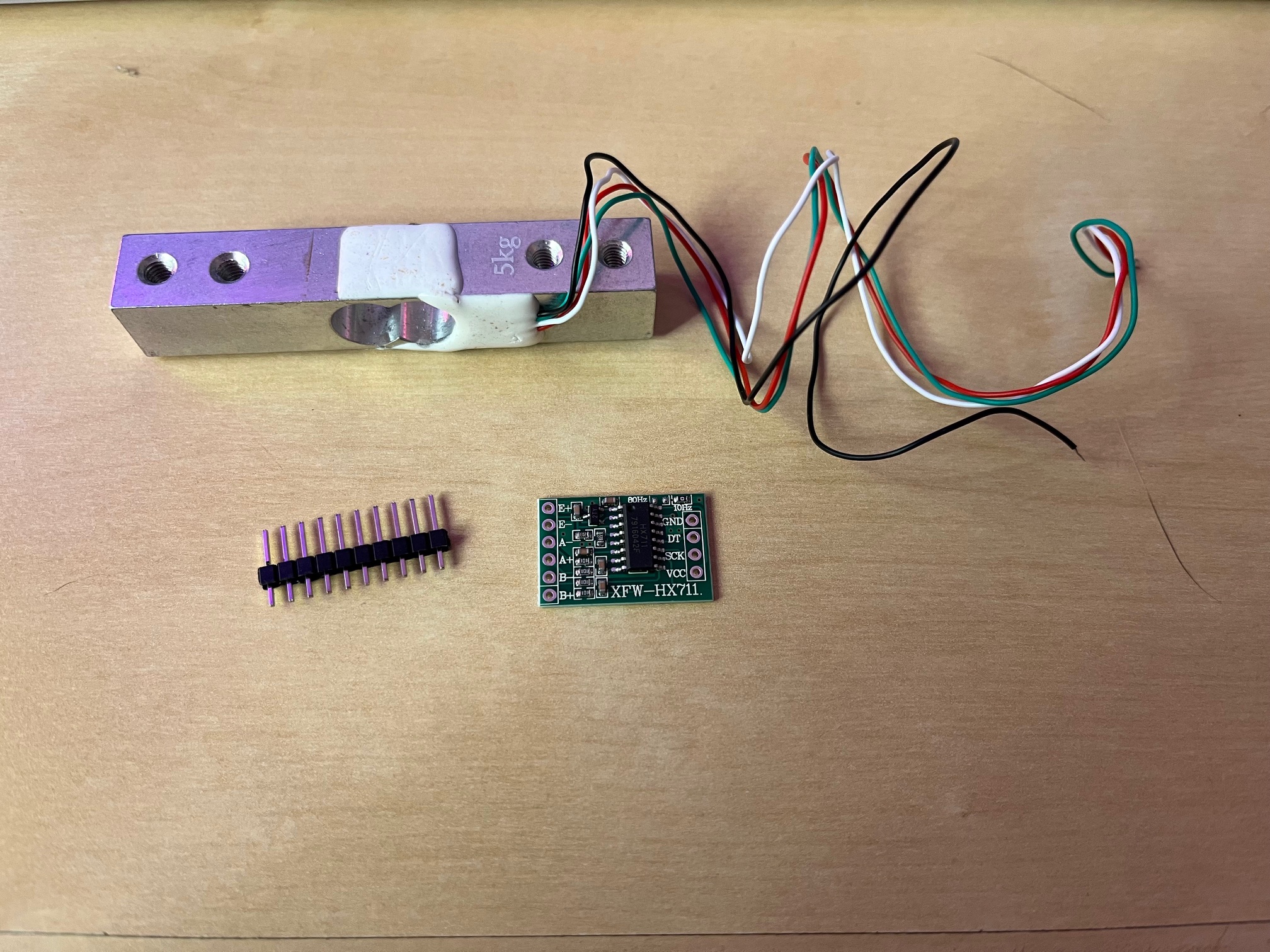 Load cell mounted between basket and door